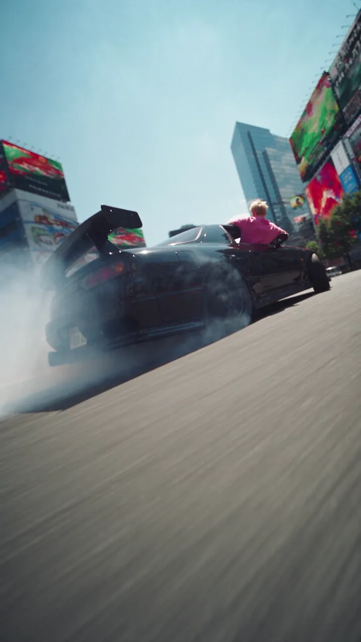Official Wild Ride example frame showing a drifting sports car.